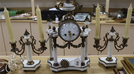 A Louis XVI white marble clock set